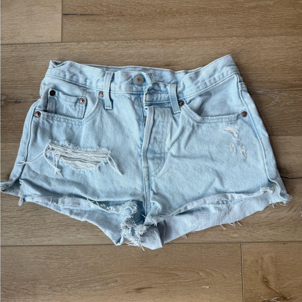 Levi 501 Blue High-Waisted Jean Shorts with Distressed Style